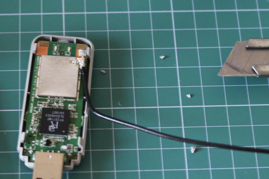 WiFi Adapter PCB next to an antenna and it’s plastic shell